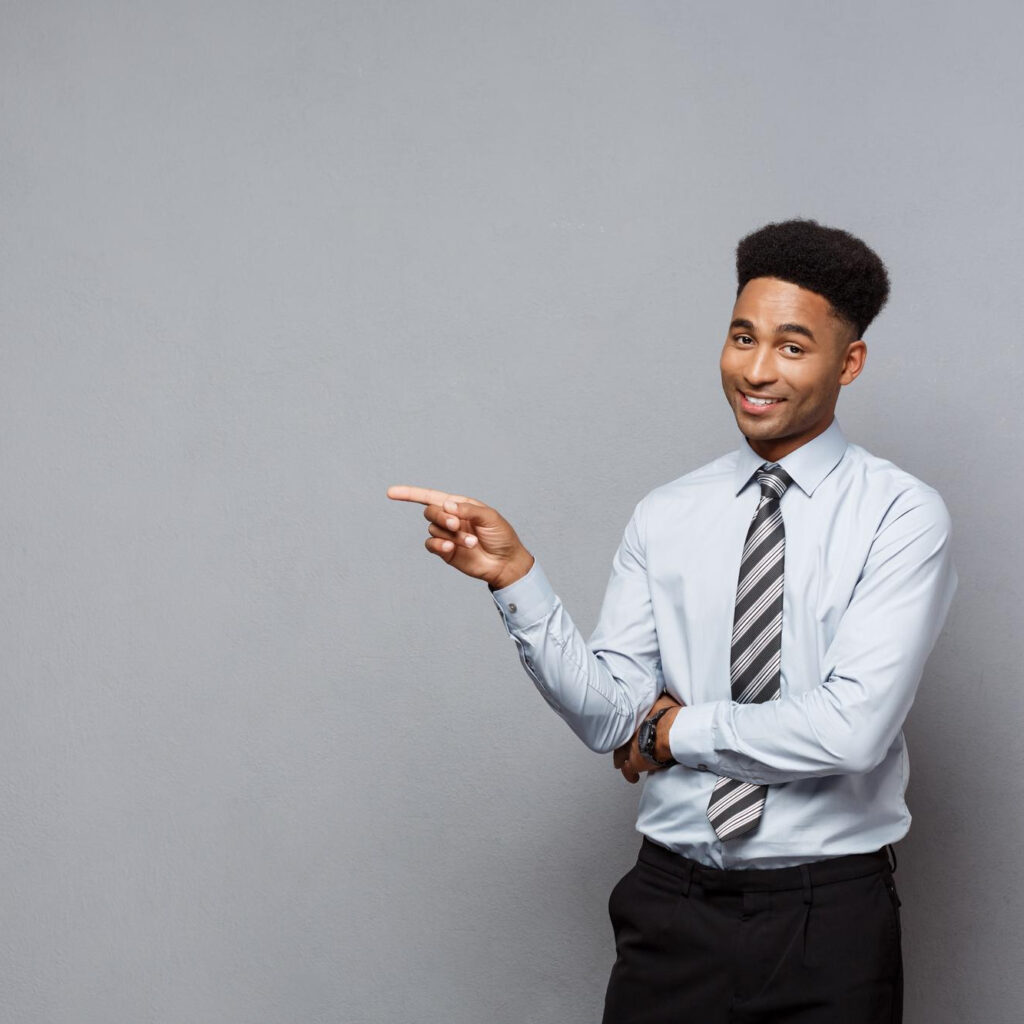 business-concept-confident-thoughtful-young-african-american-pointing-finger-on-side-over-grey-background